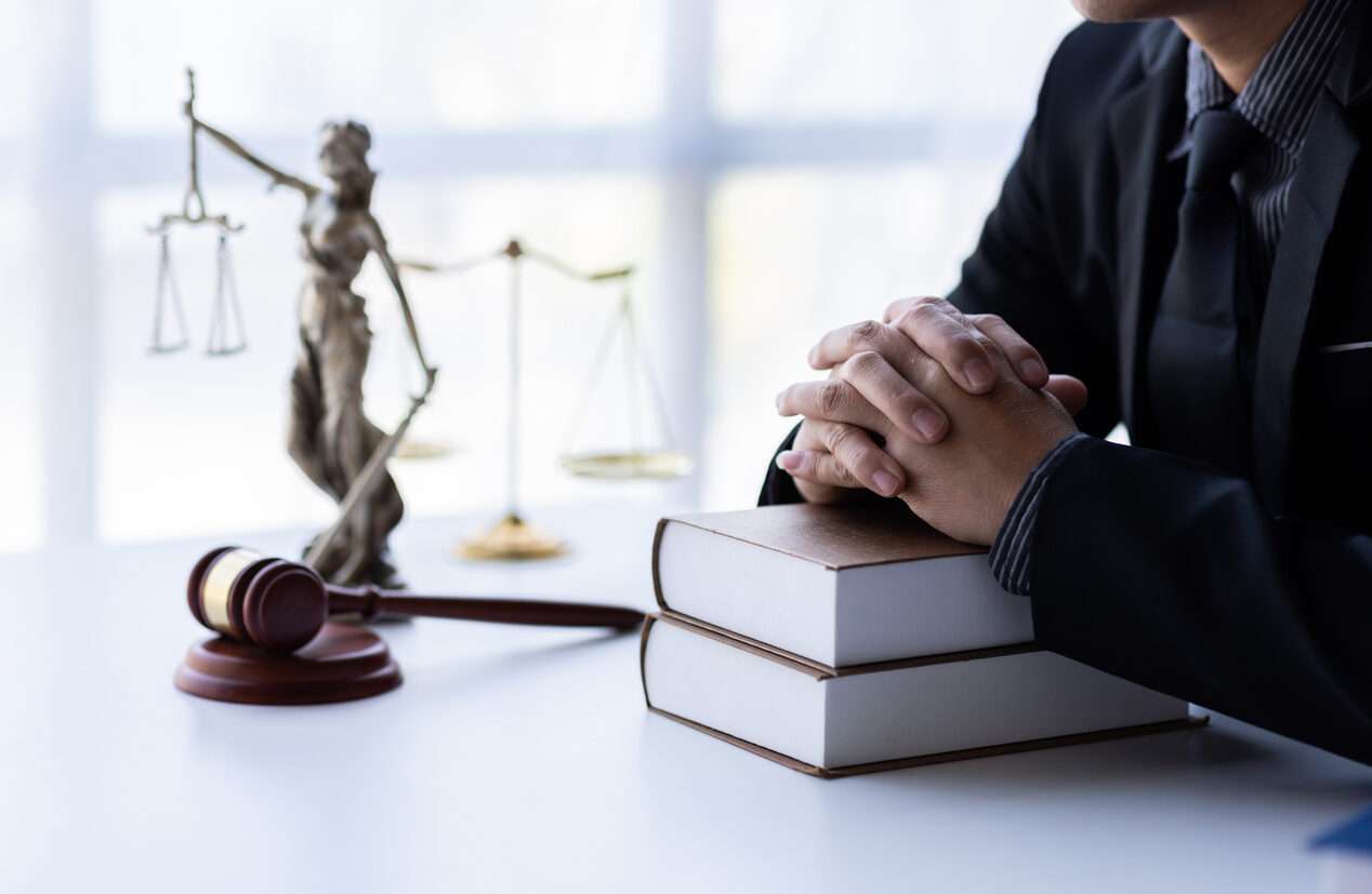 personal injury in El Segundo Lawyer is sitting on the table with law books