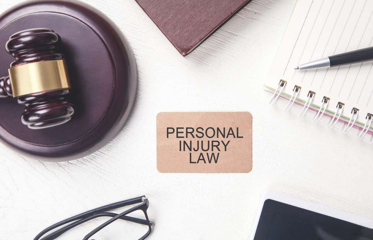 Gavel on the table with persnal injury law board
