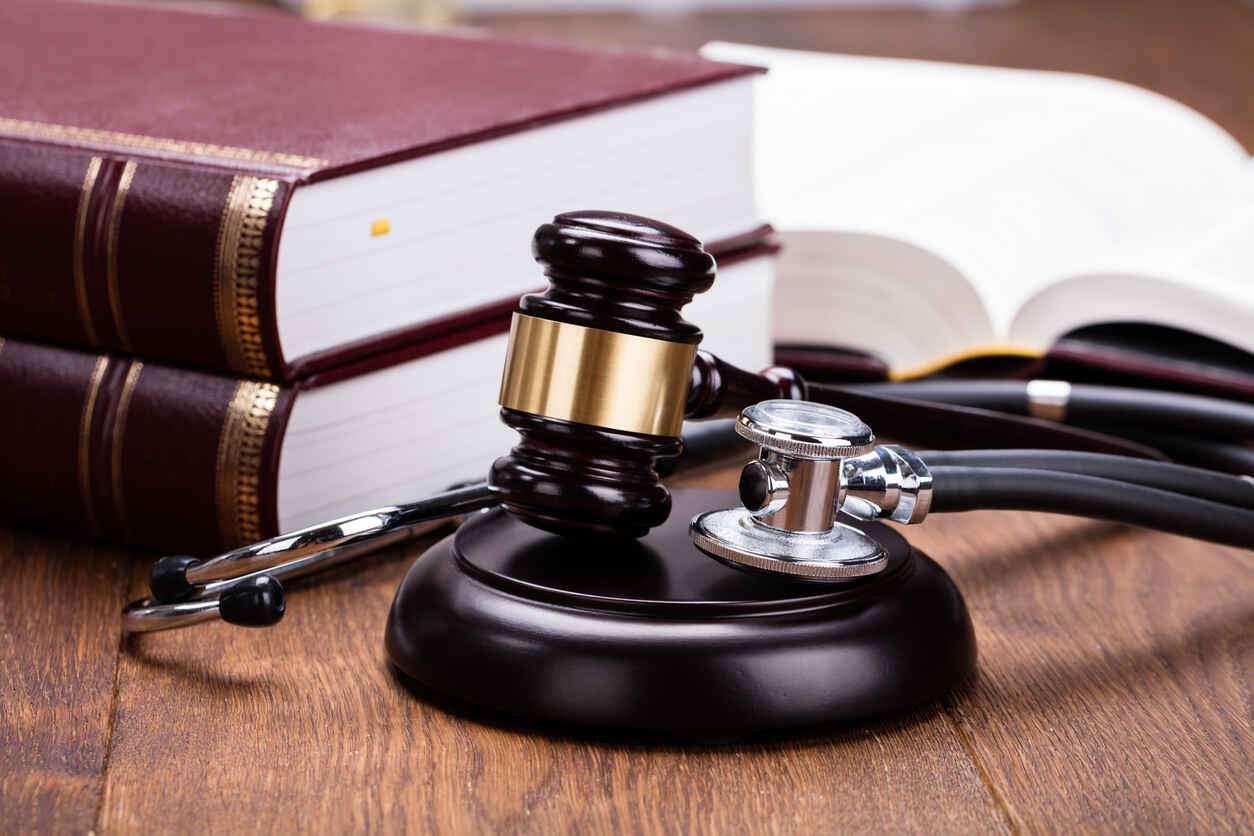 lawyer gavel and doctor satraoscope on the table