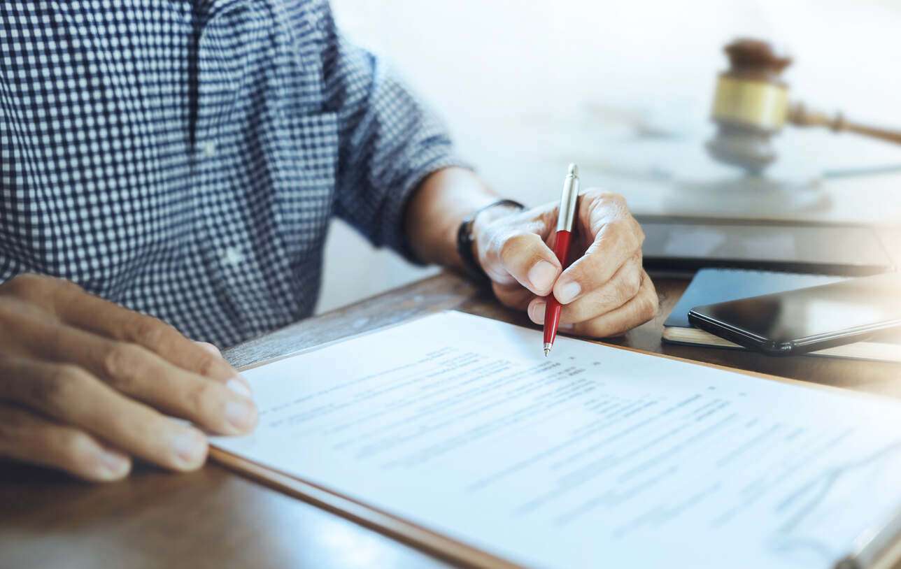 woodland hills worker comp lawyer lawyer writing and working in woodland office