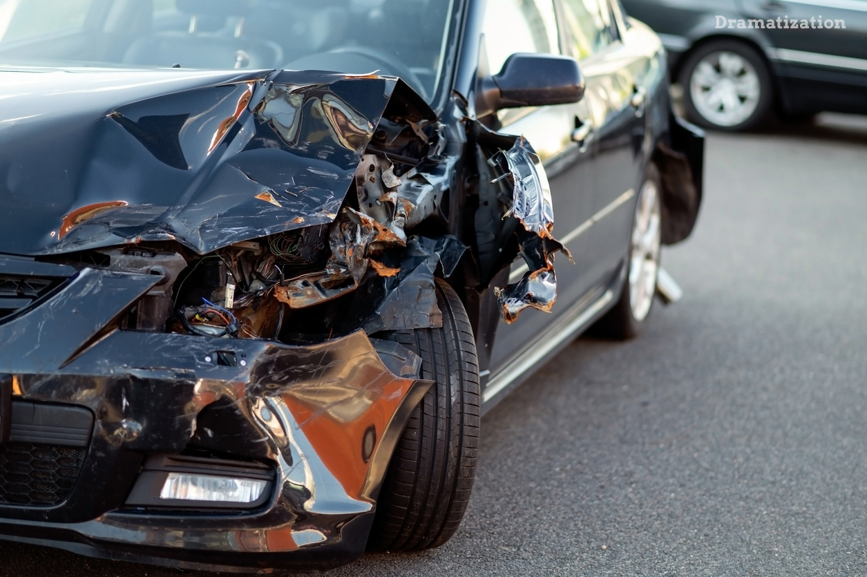 Close up of a smashed in car bumper.