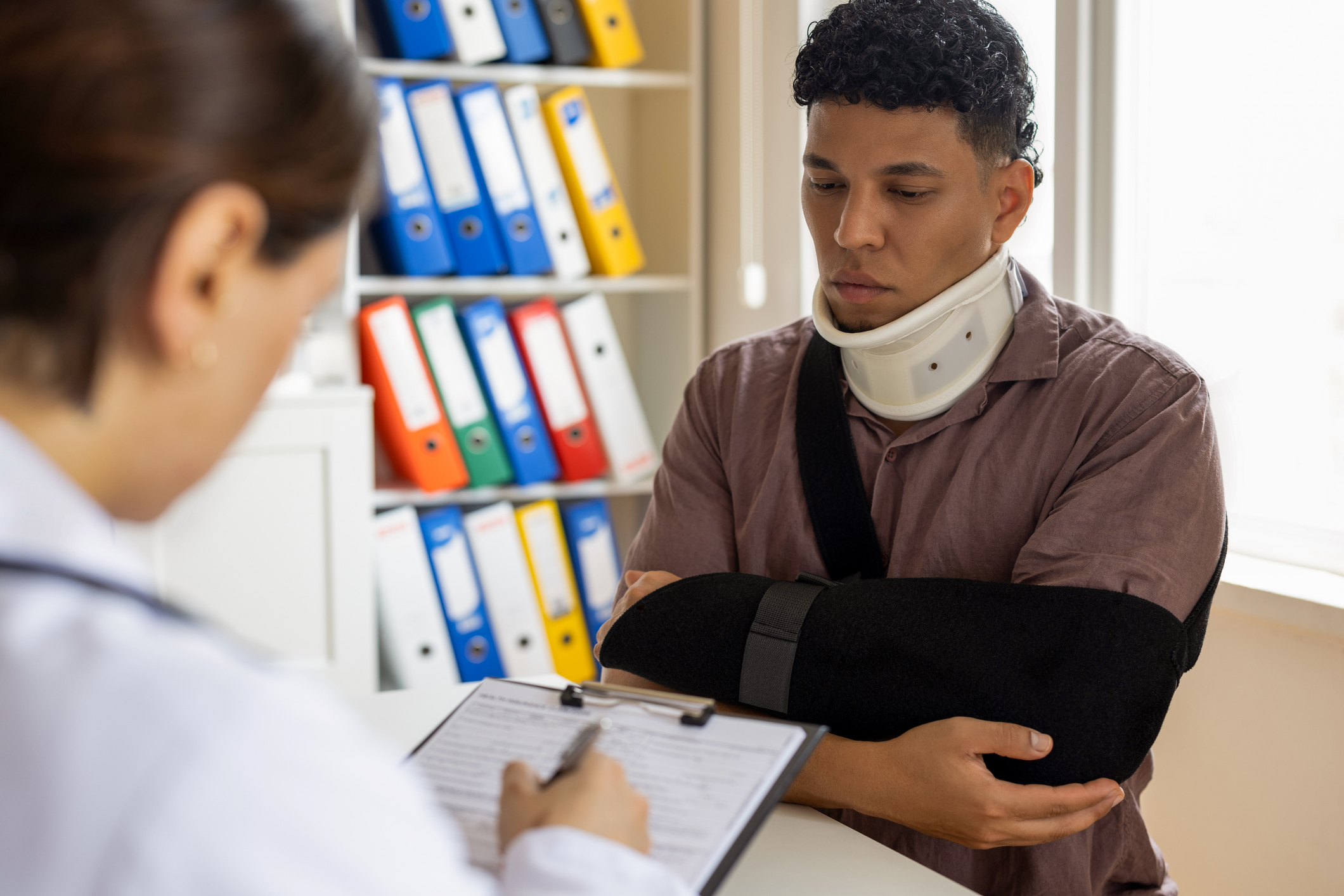 Exhausted injured woman at office