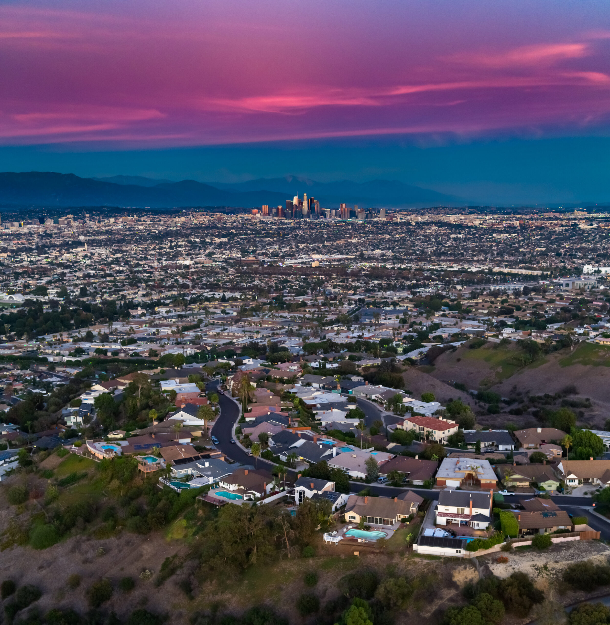 Aerial View of Culver City with Downtown LA in Distance on Dramatic Evening